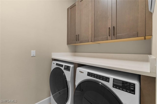 7282 Saona Ct, Naples, FL 34113 - washroom featuring cabinet space, washing machine and clothes dryer, and baseboards