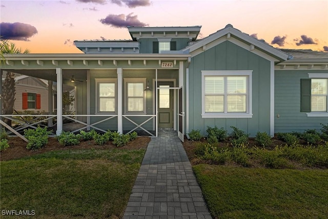 7282 Saona Ct, Naples, FL 34113 - view of front facade with board and batten siding