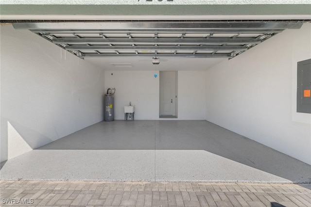 7282 Saona Ct, Naples, FL 34113 - garage with water heater, electric panel, and a sink