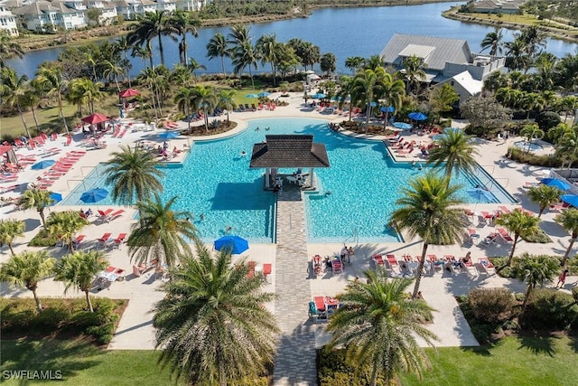 7282 Saona Ct, Naples, FL 34113 - view of swimming pool with a water view