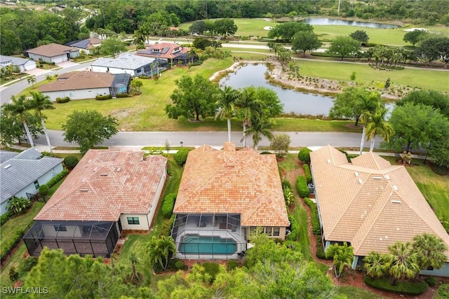 bird's eye view with view of golf course, a residential view, and a water view