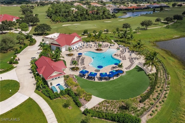 aerial view with golf course view and a water view