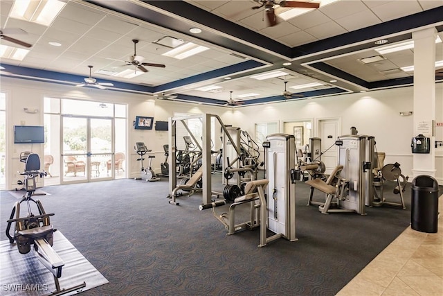 workout area featuring visible vents, a paneled ceiling, and a ceiling fan