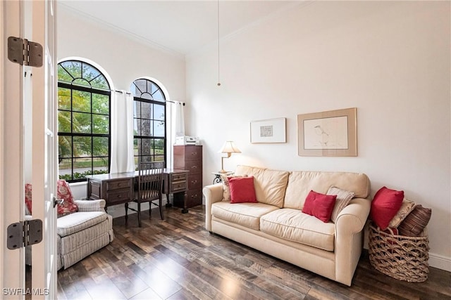 living room featuring baseboards and wood finished floors