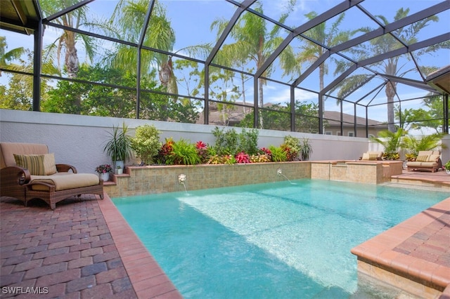view of swimming pool featuring a lanai, a patio, and a fenced in pool