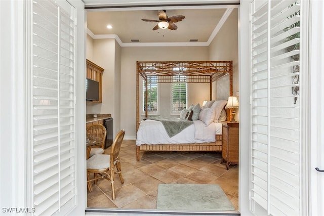 bedroom with ornamental molding, visible vents, tile patterned floors, and a ceiling fan