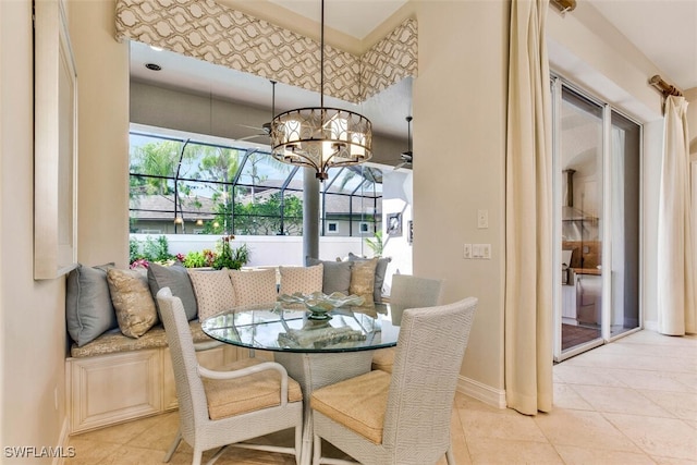 dining room featuring light tile patterned floors and baseboards