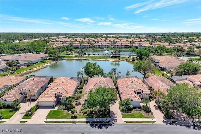 aerial view with a water view and a residential view