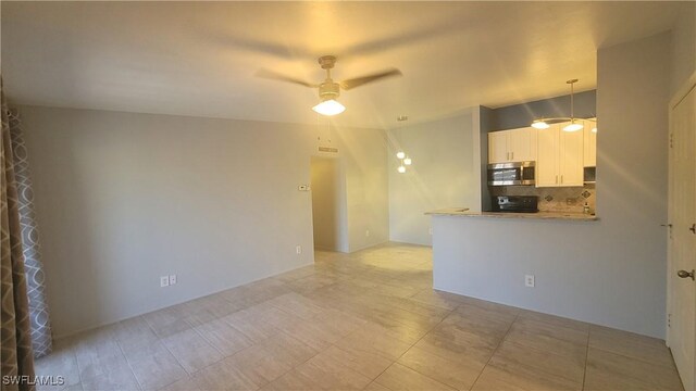 spare room featuring ceiling fan