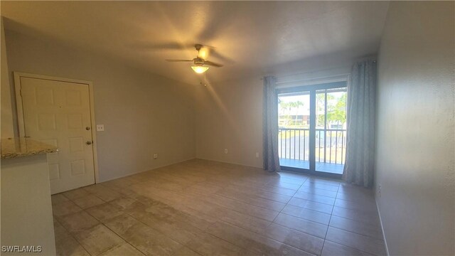 unfurnished room with light tile patterned floors and ceiling fan