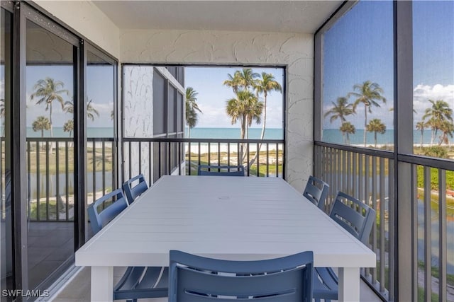 2445 W Gulf Dr Unit 21E, Sanibel, FL 33957 - sunroom with plenty of natural light and a water view