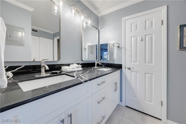 2445 W Gulf Dr Unit 21E, Sanibel, FL 33957 - bathroom with a sink, visible vents, ornamental molding, and tile patterned floors