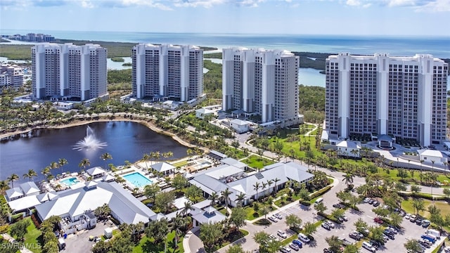 aerial view of a nearby body of water and a pool area