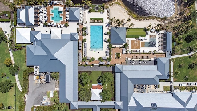 aerial view of property and surrounding area with a pool area