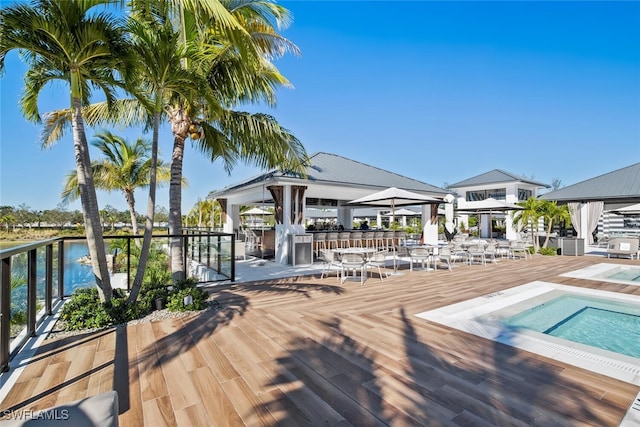 13945 Old Coast Rd Unit 302, Naples, FL 34110 - wooden deck with a gazebo and a water view
