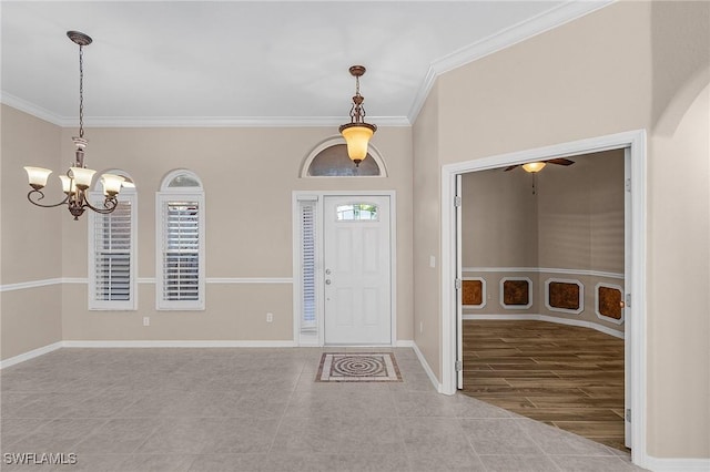 13773 Ox Bow Rd, Fort Myers, FL 33905 - entryway featuring ceiling fan with notable chandelier, baseboards, and ornamental molding
