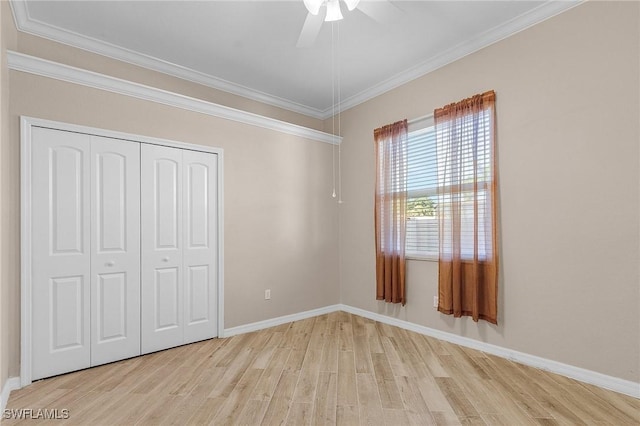 13773 Ox Bow Rd, Fort Myers, FL 33905 - unfurnished bedroom featuring a closet, crown molding, baseboards, and wood finished floors