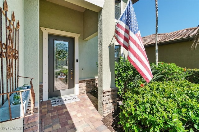 13570 San Georgio Dr, Estero, FL 33928 - entrance to property with stucco siding and stone siding