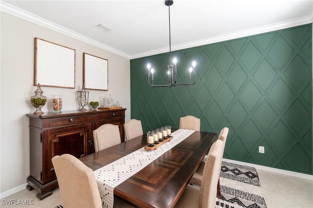 13570 San Georgio Dr, Estero, FL 33928 - dining space with a notable chandelier, crown molding, an accent wall, baseboards, and visible vents