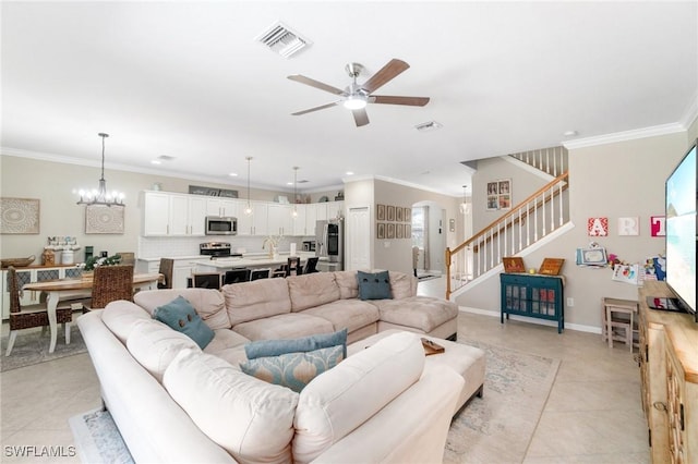 13570 San Georgio Dr, Estero, FL 33928 - living area with ceiling fan with notable chandelier, visible vents, and crown molding