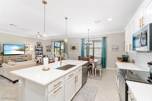 13570 San Georgio Dr, Estero, FL 33928 - kitchen featuring light countertops, visible vents, ornamental molding, stainless steel appliances, and a sink