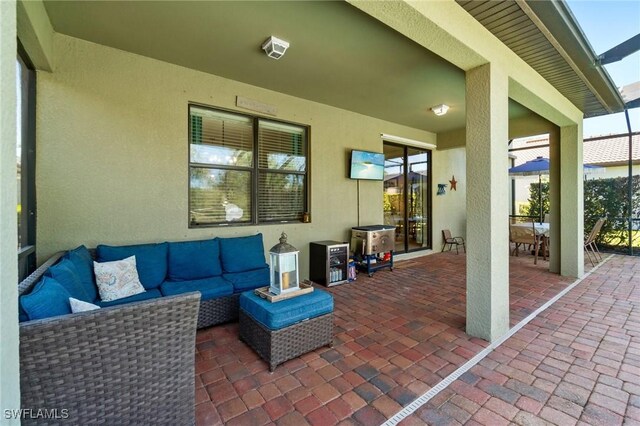 13570 San Georgio Dr, Estero, FL 33928 - view of patio / terrace featuring an outdoor living space and a lanai