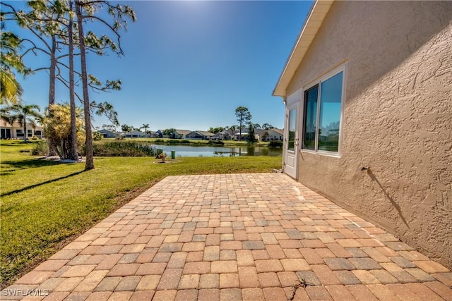 view of patio / terrace featuring a water view