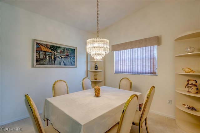 dining room with baseboards, a notable chandelier, and carpet