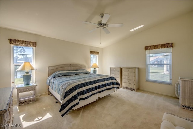 carpeted bedroom with a ceiling fan, baseboards, and lofted ceiling