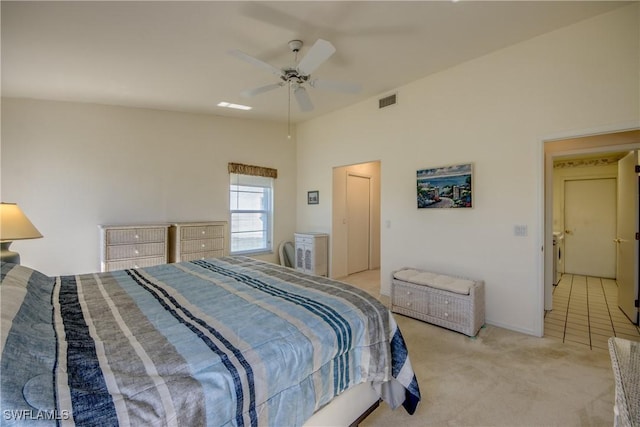 bedroom featuring light colored carpet, visible vents, and a ceiling fan