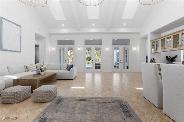 505 Harbour Dr, Naples, FL 34103 - living area with french doors, a skylight, light tile patterned floors, and beamed ceiling