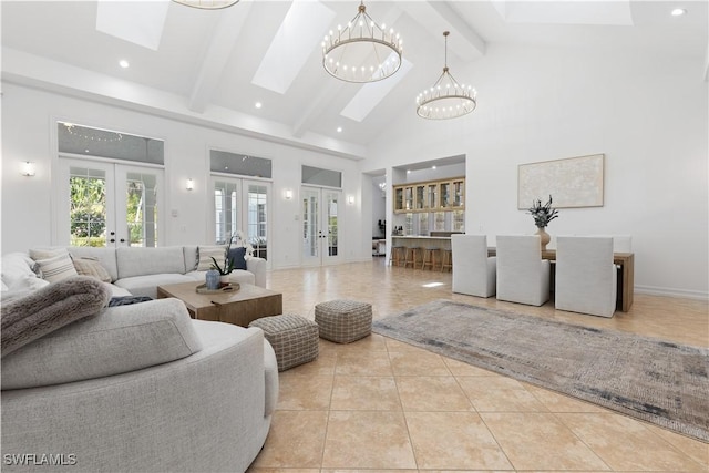 505 Harbour Dr, Naples, FL 34103 - living area with high vaulted ceiling, beamed ceiling, a skylight, tile patterned floors, and french doors