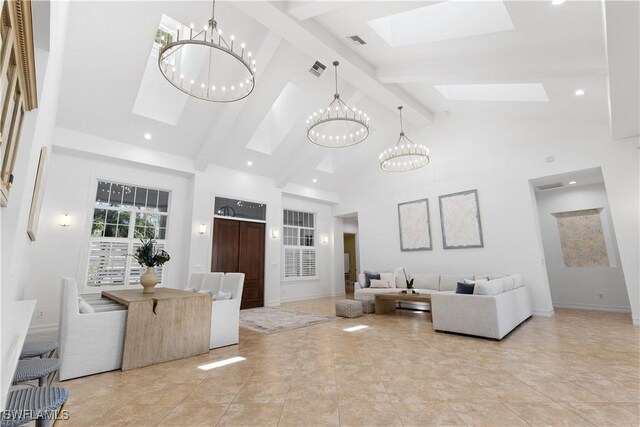 505 Harbour Dr, Naples, FL 34103 - interior space featuring a chandelier, visible vents, beamed ceiling, a skylight, and high vaulted ceiling