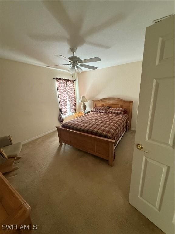 12597 Gemstone Ct, Fort Myers, FL 33913 - bedroom with baseboards, light colored carpet, and a ceiling fan