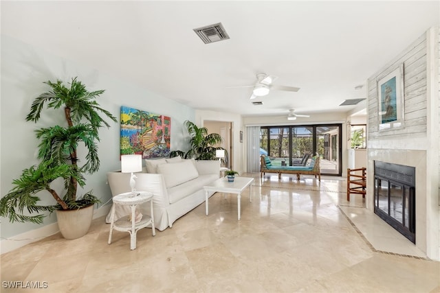 6024 Perthshire Ln, Fort Myers, FL 33908 - living area featuring a premium fireplace, baseboards, visible vents, and ceiling fan