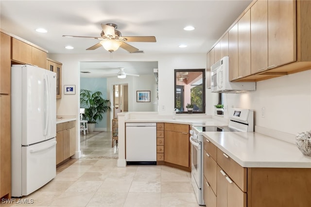 6024 Perthshire Ln, Fort Myers, FL 33908 - kitchen with white appliances, a peninsula, light countertops, and ceiling fan