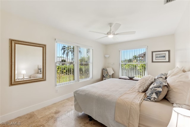 6024 Perthshire Ln, Fort Myers, FL 33908 - bedroom featuring light tile patterned floors, baseboards, and a ceiling fan