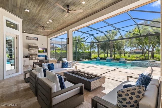 view of patio / terrace with an outdoor kitchen, an outdoor living space with a fire pit, a ceiling fan, and a pool with connected hot tub