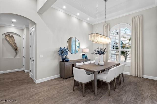 dining area with ornamental molding, wood finished floors, baseboards, arched walkways, and recessed lighting