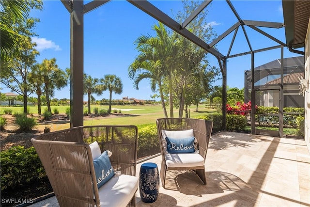 view of patio / terrace featuring glass enclosure and golf course view