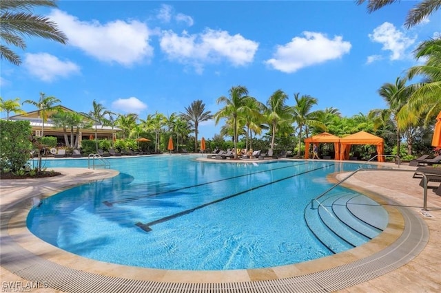 community pool with a gazebo