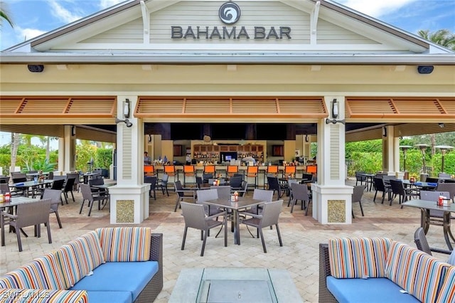 view of patio with an outdoor hangout area and outdoor dining area