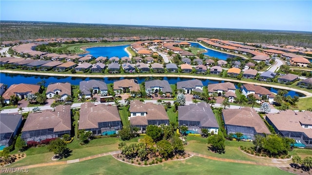 aerial view of property and surrounding area with nearby suburban area, a large body of water, and a golf club
