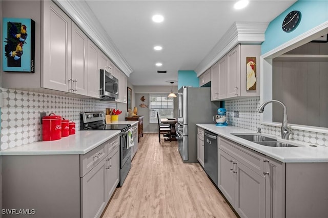 62 Lanai Cir Unit 62, Naples, FL 34112 - kitchen with appliances with stainless steel finishes, light wood-style floors, light countertops, decorative backsplash, and recessed lighting