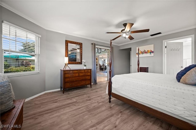 62 Lanai Cir Unit 62, Naples, FL 34112 - bedroom with ornamental molding, wood finished floors, and ceiling fan