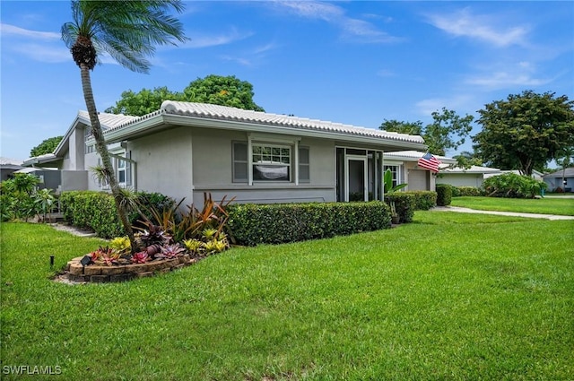 62 Lanai Cir Unit 62, Naples, FL 34112 - view of front of property featuring a front yard and stucco siding