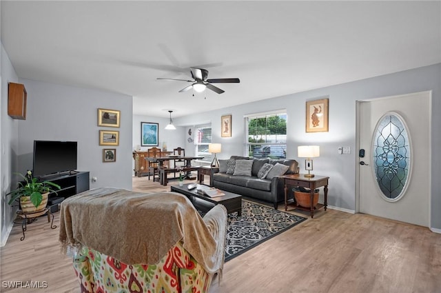 62 Lanai Cir Unit 62, Naples, FL 34112 - living room featuring light wood-type flooring and ceiling fan