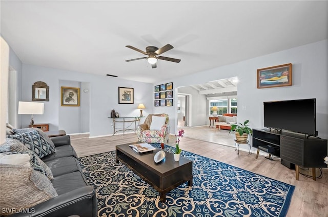 62 Lanai Cir Unit 62, Naples, FL 34112 - living area with ceiling fan and wood finished floors