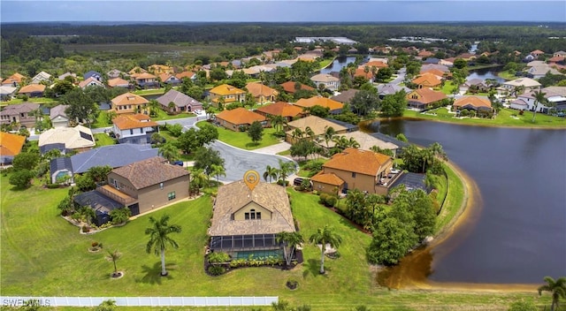 birds eye view of property with a residential view and a water view