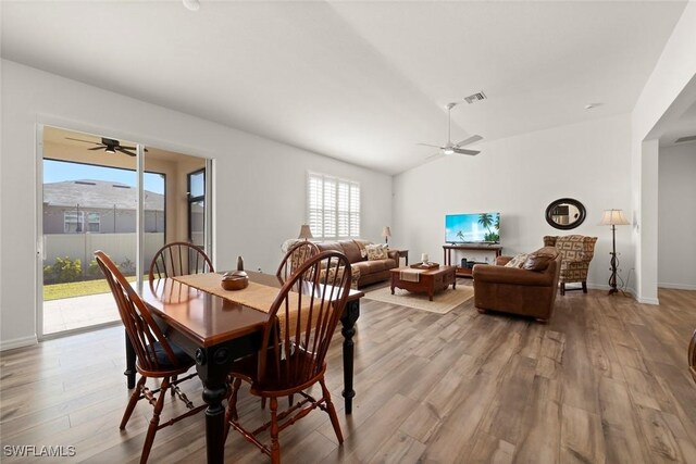 6667 Estero Bay Dr, Fort Myers, FL 33908 - dining room featuring lofted ceiling, ceiling fan, and wood finished floors